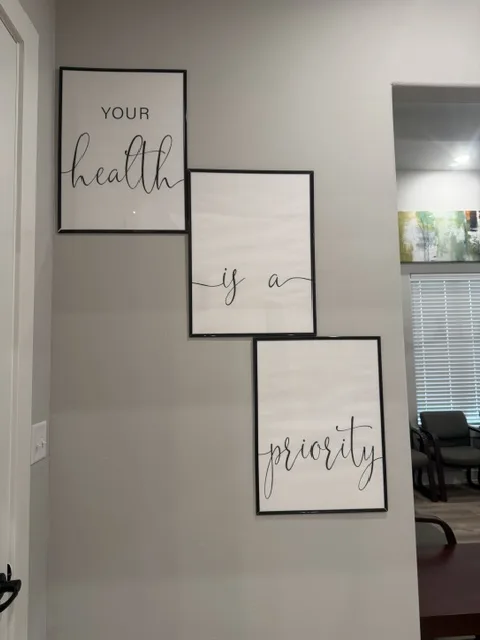 Framed wall art in the clinic that reads: Your health is a priority